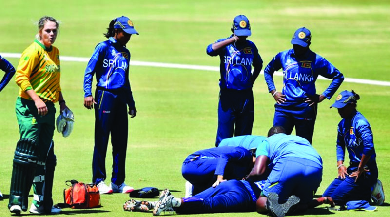woman cricketer fell down by hitting ball