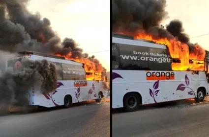 Orange travel bus catches fire.